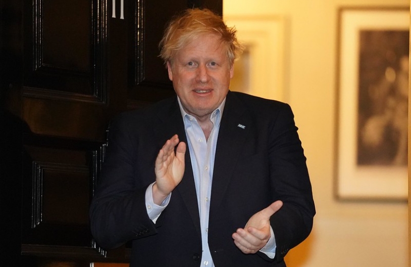 Boris Johnson clapping for carers.